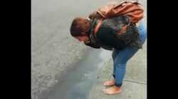 Colombian puta barefoot and vomit in public in the street